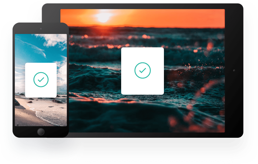 Computer and tablet with check mark on displays